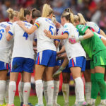 England team huddle before a match, symbolizing their unity and determination in the upcoming UEFA Women's EURO 2025