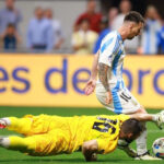 Lionel Messi battles for the ball