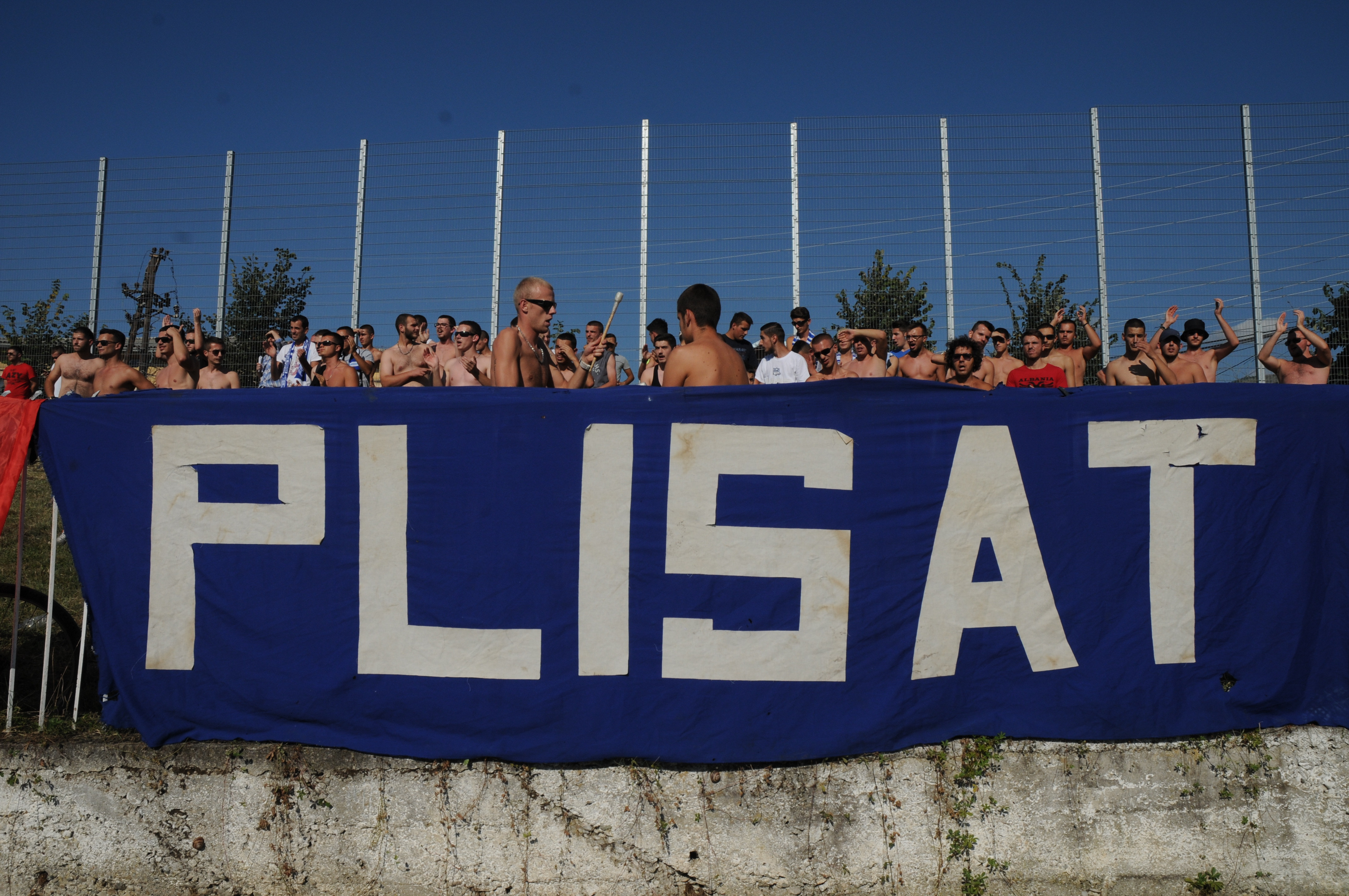 The Plisat flag is displayed by FC Pristina fans. Photo by James Montague