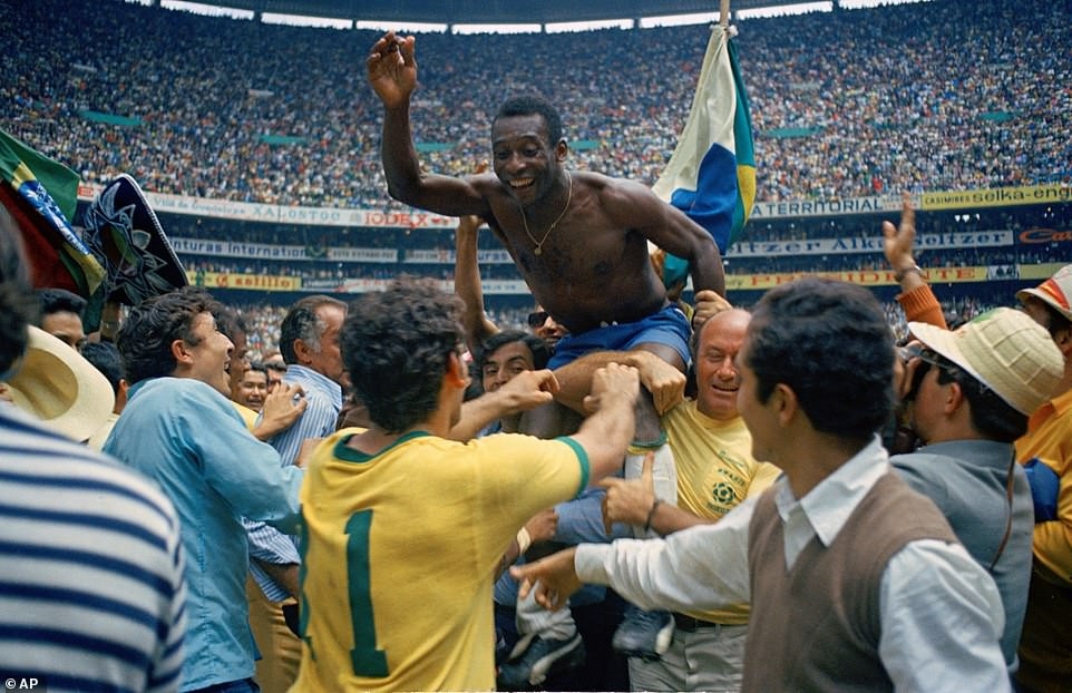 Pele is carried shoulder high from the field after Brazil