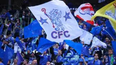 Chelsea fans wave banners