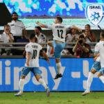 GABY KANICHOWSKY (jumping in air) celebrates with his Israel teammates after scoring in stoppage time late Tuesday night to give the blue-and-white a 1-0 victory over visiting Belarus at Bloomfield Stadium in their Group I Euro 2024 qualifier