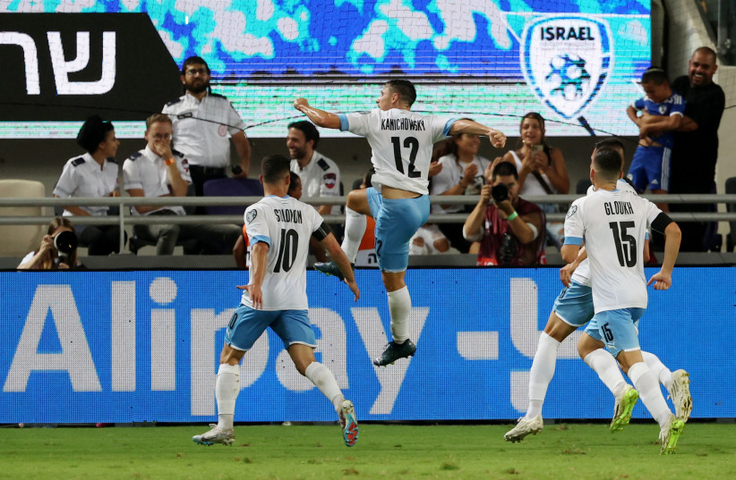 GABY KANICHOWSKY (jumping in air) celebrates with his Israel teammates after scoring in stoppage time late Tuesday night to give the blue-and-white a 1-0 victory over visiting Belarus at Bloomfield Stadium in their Group I Euro 2024 qualifier