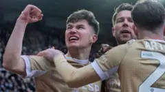 Cameron Congreve celebrates with teammates after scoring for Bromley
