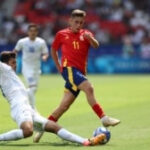 Khusanov, seen here tackling Fermin Lopez in Uzbekistan