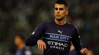 Joao Cancelo of Manchester City in the unlicensed knock-off third kit