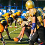 Quarterback calling out plays at the line of scrimmage