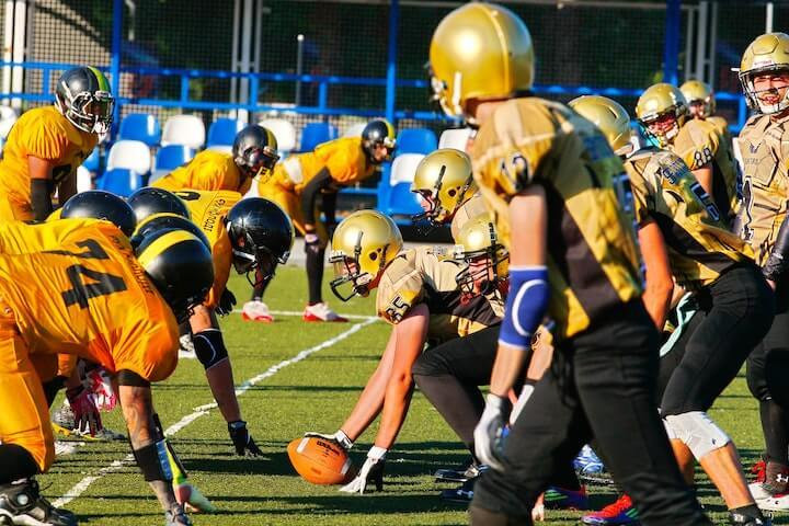 Quarterback calling out plays at the line of scrimmage