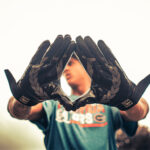 Close up image of a player wearing football gloves.