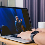 Person casting a church live stream to smart TV from laptop