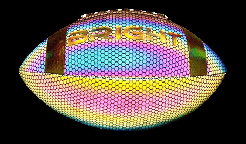 Bright football reflects light back to the camera