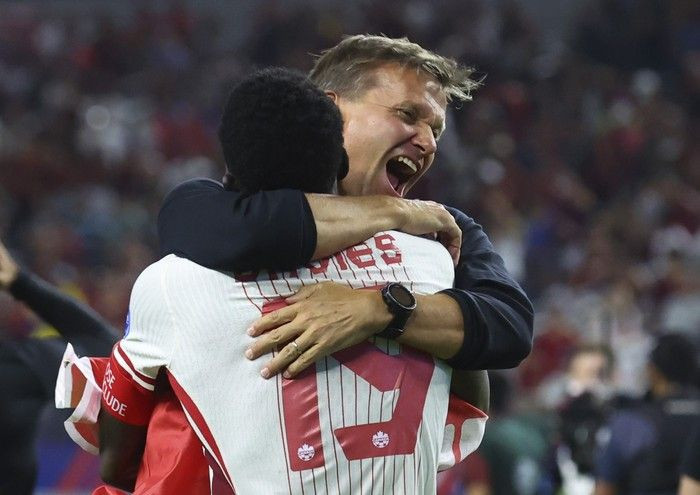 Alphonso Davies and Jesse Marsch celebrate a win