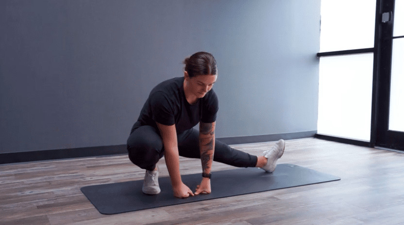 Football Player Stretching