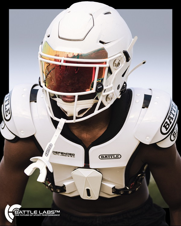 Athlete wearing white football gear and helmet with visor