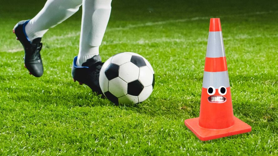 Football training and a plastic traffic cone