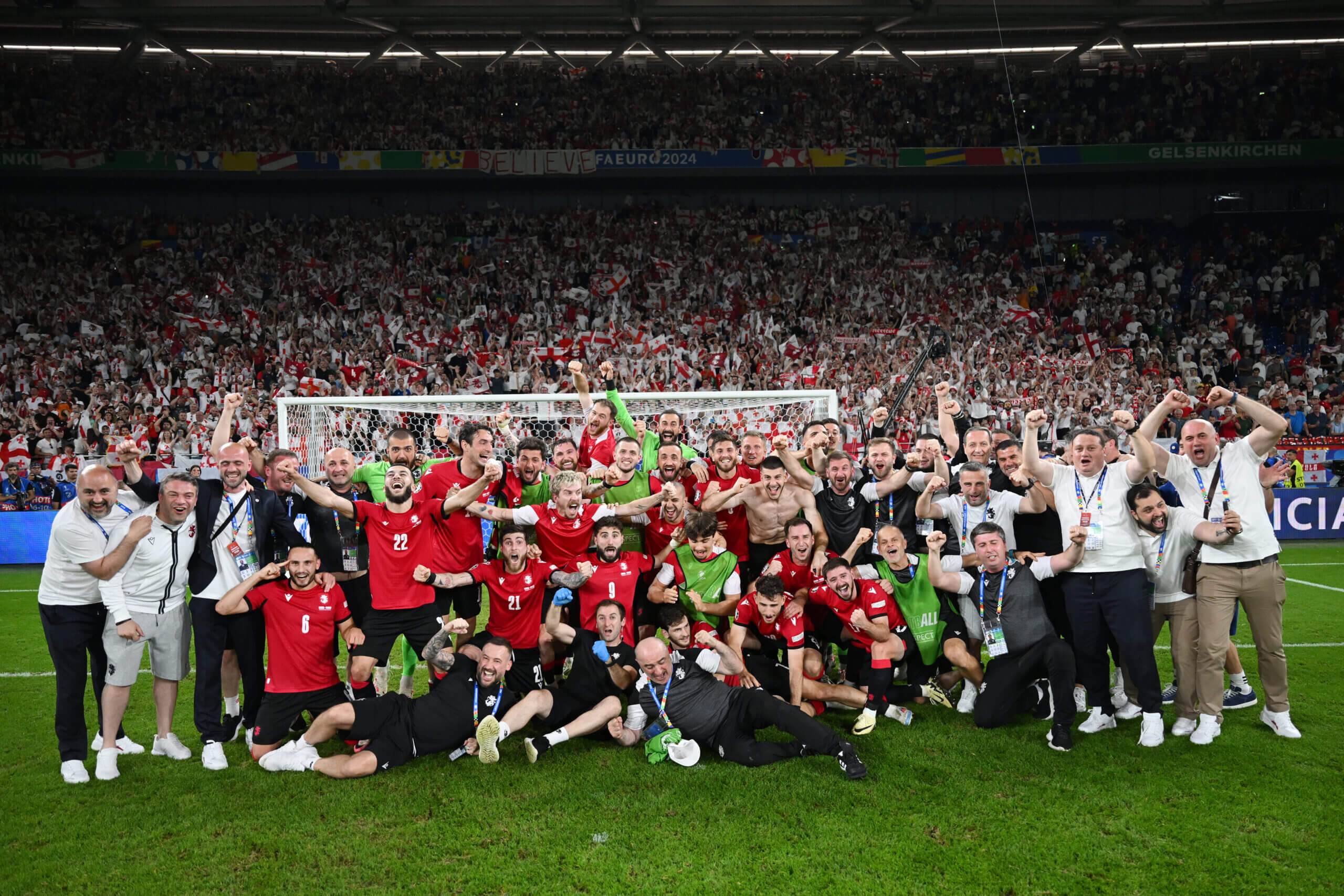 Georgia's players and staff celebrate a famous victory
