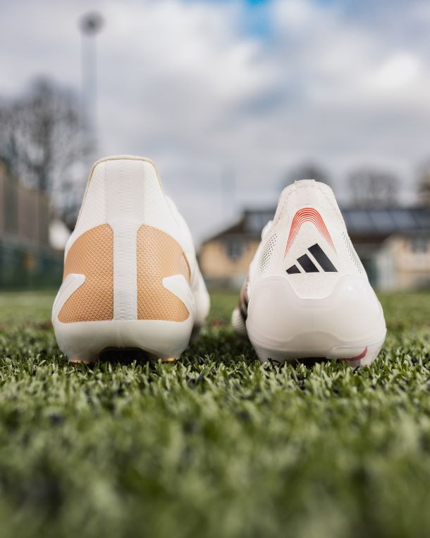 Illustration comparing the heel height of football versus rugby boots