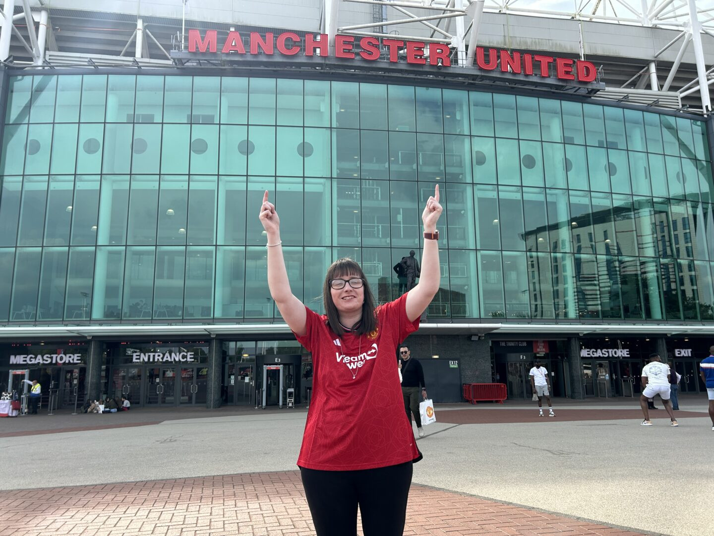 Holly in front of Old Trafford. She