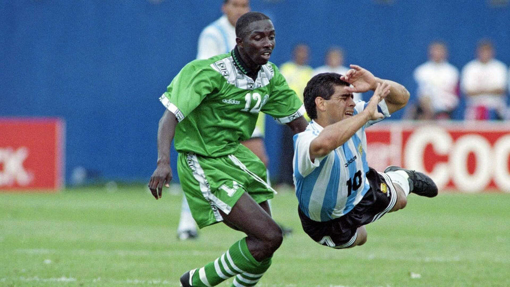 Diego Maradona with a Player in Nigeria 1994 Home Kit