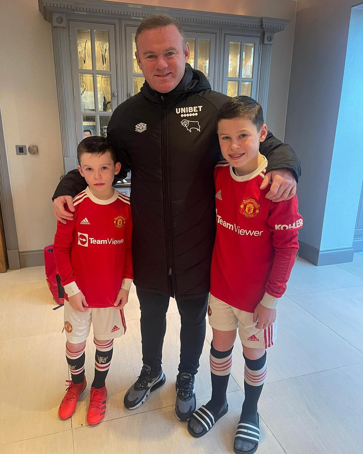 Wayne Rooney poses with Kit and Kai