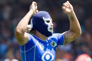 Jaguares de Chiapas goalkeeper Omar Ortiz puts on a mask to celebrate a goal against Pumas in 2006.