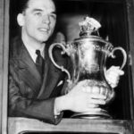 Sunderland captain Raich Carter with the FA Cup trophy on his way back to Sunderland by train after his team had beaten Preston in the 1937 FA Cup Final May 1937. Pic courtesy of Mirrorpix