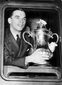 Sunderland captain Raich Carter with the FA Cup trophy on his way back to Sunderland by train after his team had beaten Preston in the 1937 FA Cup Final May 1937. Pic courtesy of Mirrorpix