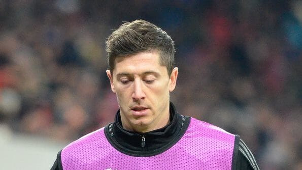 Robert Lewandowski in a Barcelona jersey, one of the highest paid footballers, earning £800k per week.