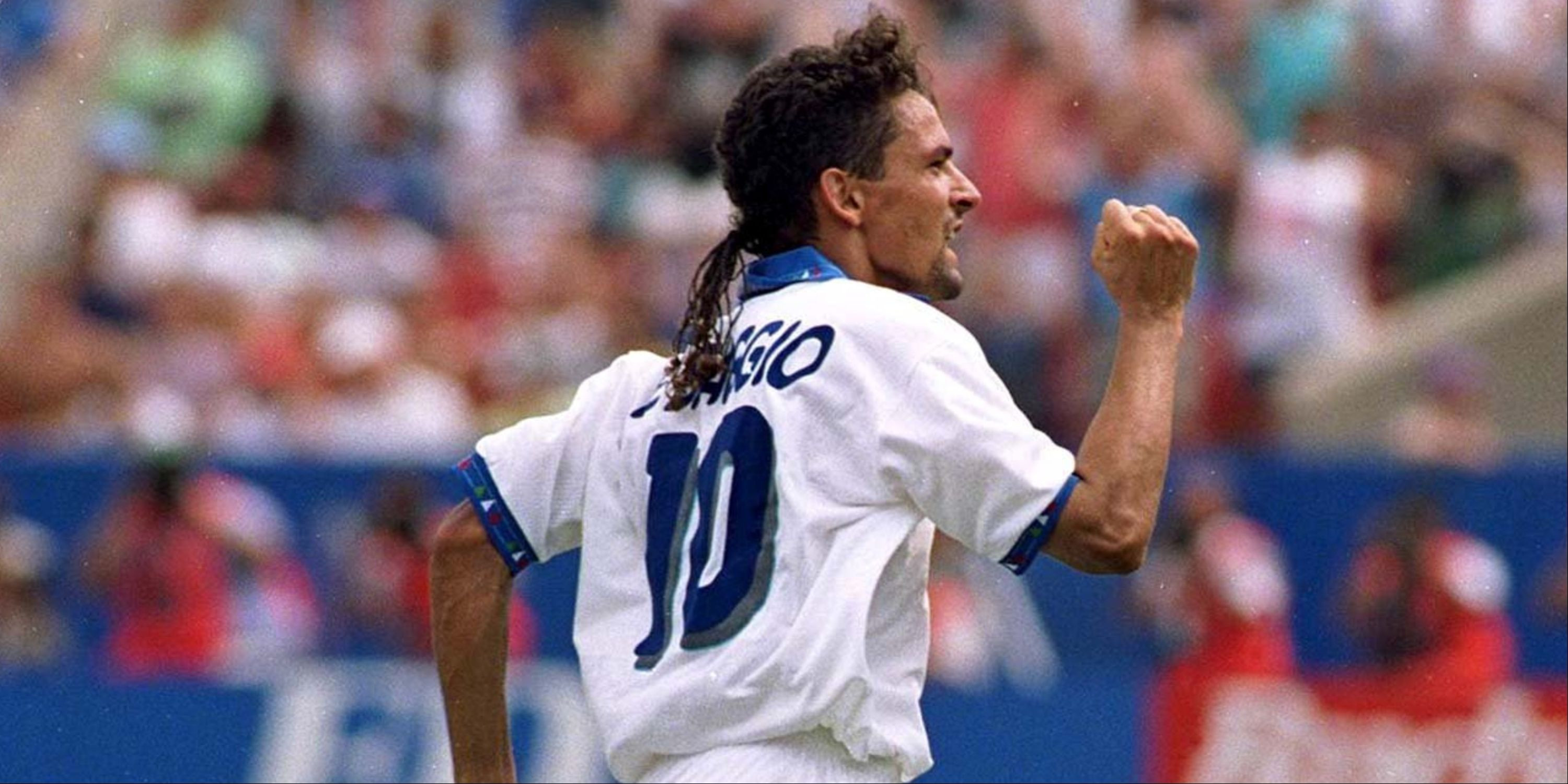 Roberto Baggio in action for Italy, dribbling past opponents with ease