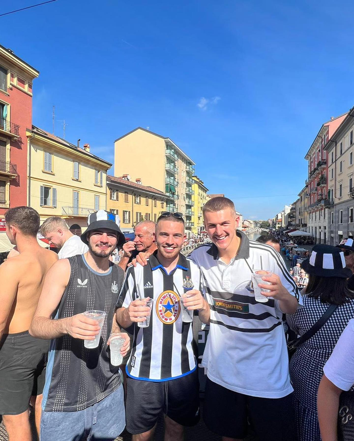 Will Shearer, center, poses in Milan ahead of Champions League clash