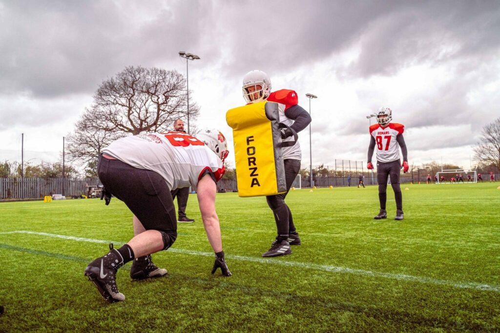 Linebacker performing tackling drills