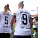 Striker Bethany England wears the number 9 jersey for Tottenham.