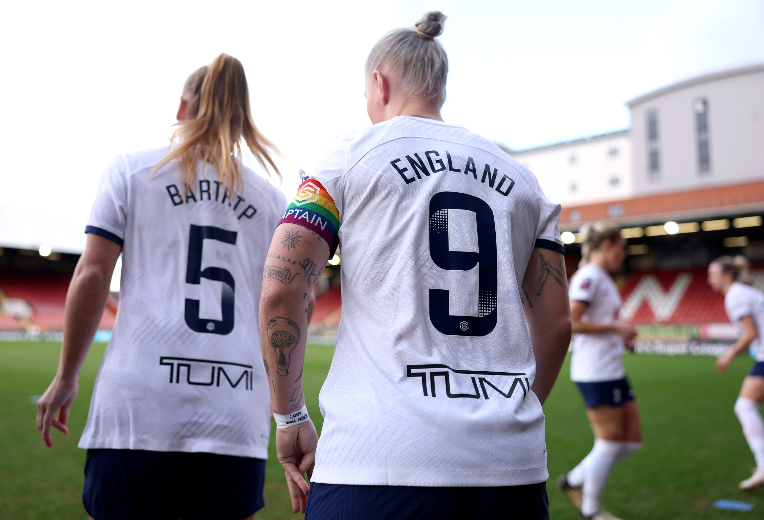 Striker Bethany England wears the number 9 jersey for Tottenham.