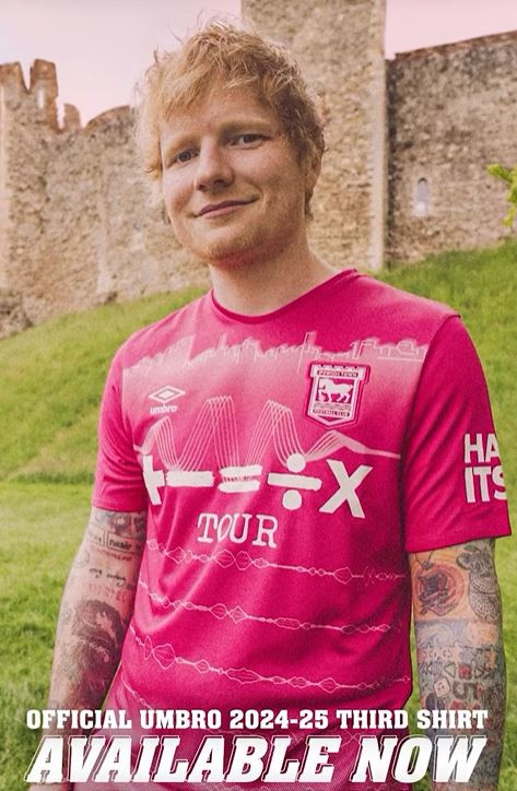 a man is wearing a pink shirt that says tour on it