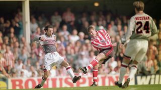 Matthew Le Tissier of Southampton challenges Ryan Giggs of Manchester United, wearing the grey away kit