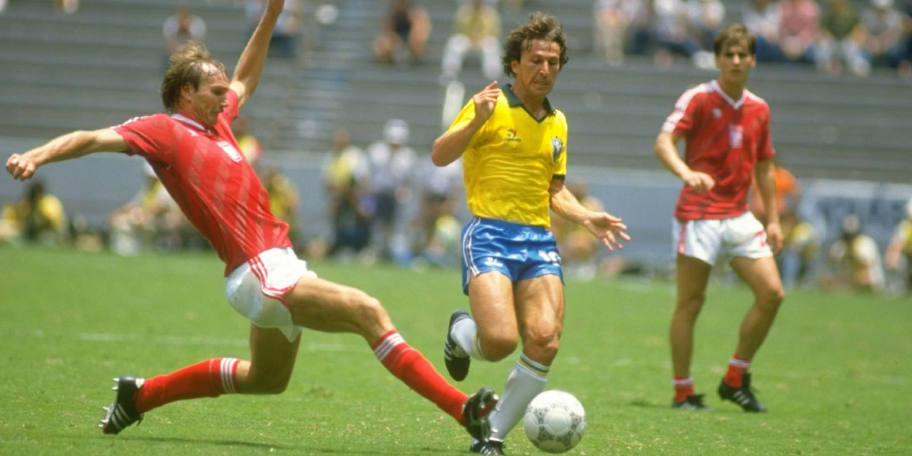 Zico dribbling with the ball, known for his exceptional technique and playmaking abilities