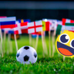 World flags on a football field representing the 2026 World Cup